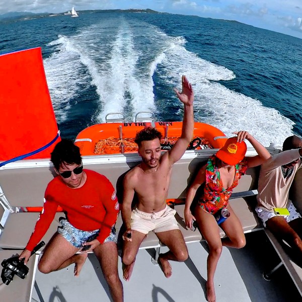 a couple of people that are standing in the water