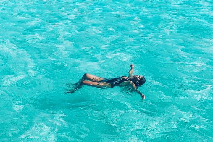 a man swimming in the ocean