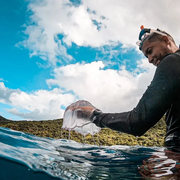 a man that is standing in the water