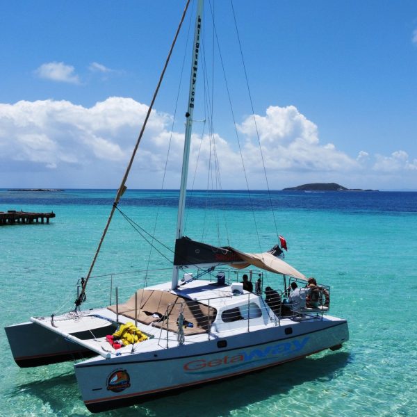 a boat is docked next to a body of water