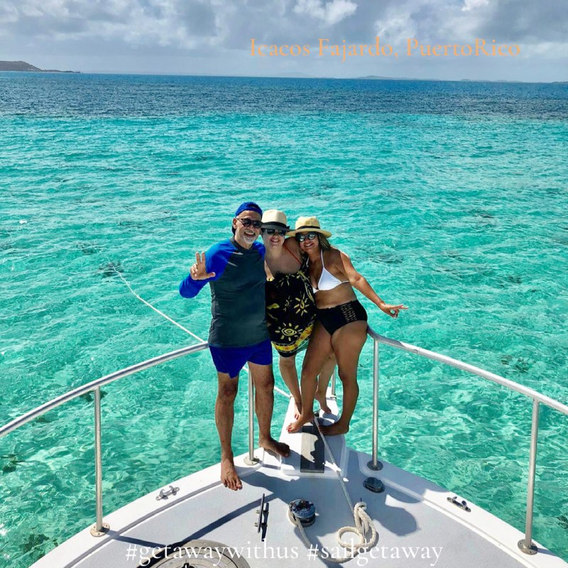 a group of people on a boat in the water