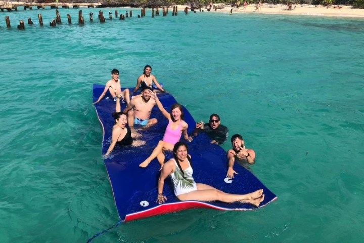 a group of people swimming in a body of water