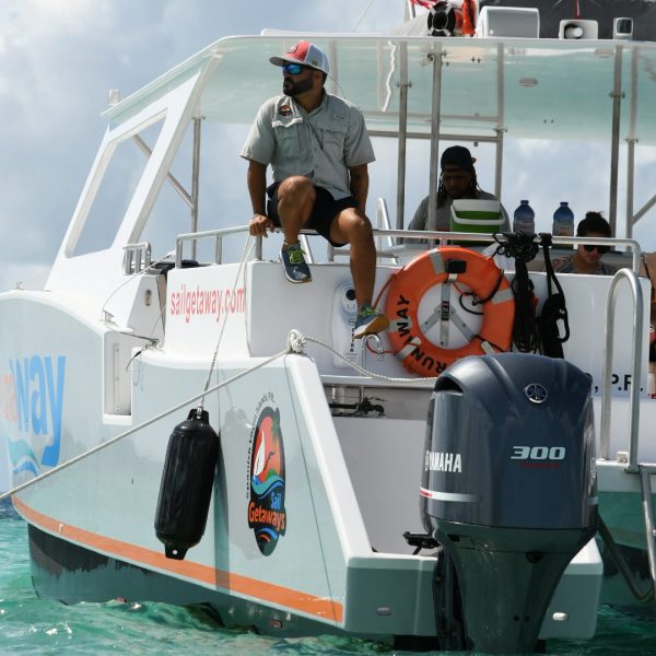 a group of people on a boat in the water