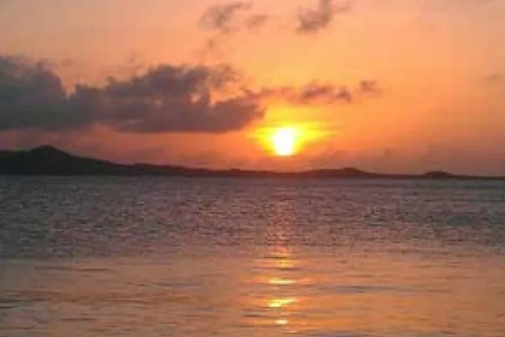 a sunset over a body of water