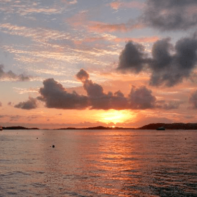 a sunset over a body of water