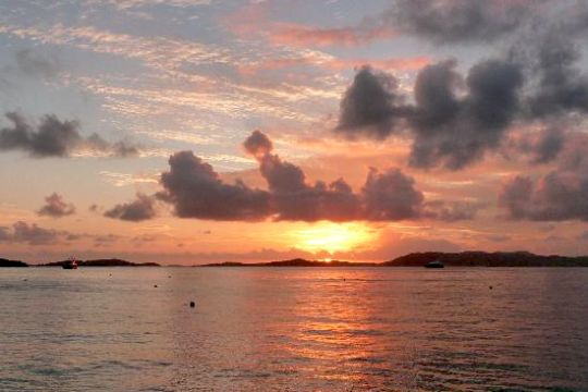 a sunset over a body of water