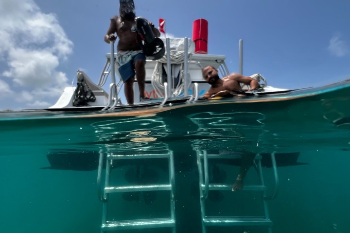 a group of people on a boat in the water