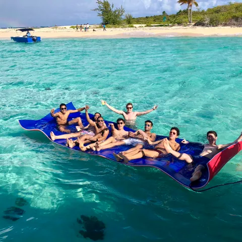 a group of people swimming in a body of water
