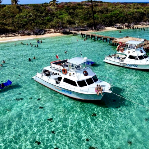 a group of people on a boat in a body of water