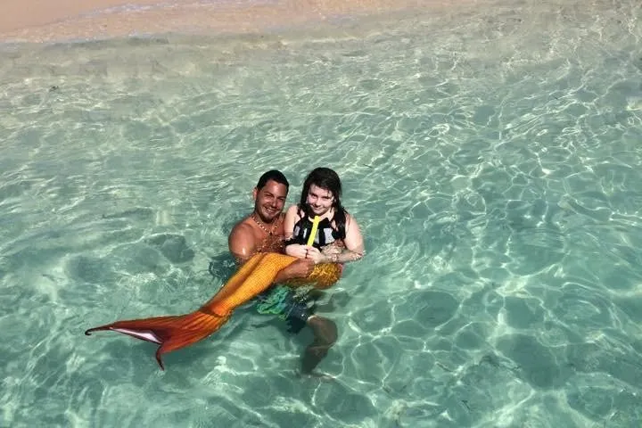 a young man riding a wave on a surfboard in the water