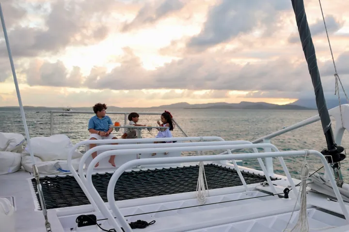 a group of people sitting at a dock